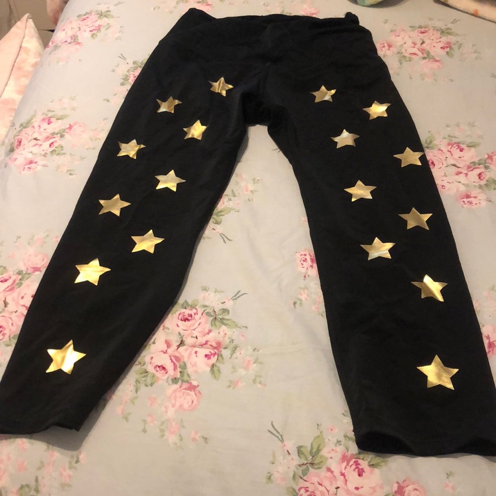 Black leggings with gold stars